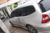 Mobil Nissan Grand Livina 2013 Highway Star terbaik di Jawa Timur 2